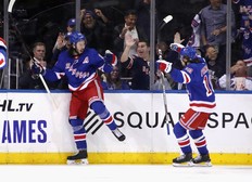 Mika Zibanejad (left) of the Rangers celebrates after combining with Artemi Panarin (right) on a highlight-reel goal at Madison Square Garden on October 03, 2019 in New York City. The Rangers defeated the Jets 6-4. (Photo by Bruce Bennett/Getty Images)
