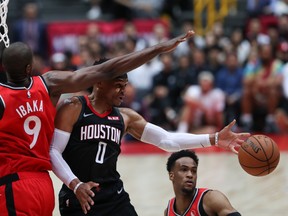 Rockets’ Russell Westbrook passes the ball against the Raptors’ Serge Ibaka. Ibaka said that having camp in Japan was really good for the team.  Getty Images