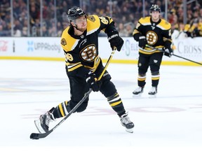 David Pastrnak of the Boston Bruins takes a shot on goal during the third period of the game against the Tampa Bay Lightning at TD Garden on October 17, 2019 in Boston, Massachusetts.