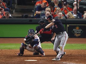Trea Turner  of the Washington Nationals hits a double against the Houston Astros during the ninth inning in Game Six of the 2019 World Series at Minute Maid Park on October 29, 2019 in Houston, Texas.
