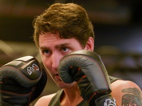 Liberal Party Leader Justin Trudeau trains with boxer Ali Nestor (not pictured) during an election campaign visit in Montrea on Oct. 2, 019. (Reuters)