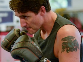 Liberal Party leader and Canadian Prime Minister Justin Trudeau trains with boxer Ali Nestor (not pictured) during an election campaign visit in Montreal on Oct. 2, 2019. (Reuters)