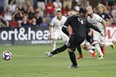 D.C. United forward Wayne Rooney scores the game-tying goal against TFC earlier this season. (USA TODAY SPORTS)