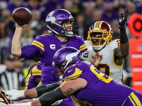 Minnesota Vikings quarterback Kirk Cousins, left, throws over Washington Redskins safety Landon Collins, right, during the first quarter at U.S. Bank Stadium in Minneapolis, Minn., Oct. 24, 2019. (Brace Hemmelgarn-USA TODAY Sports)