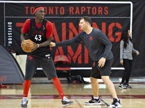 Raptors’ Pascal Siakam (left) keeps the ball away from assistant coach John Corbacio during practice at Laval University in Quebec City yesterday. Siakam worked on his ball-handling skills in the off-season.  Jacques Boissinot/The Canadian Press