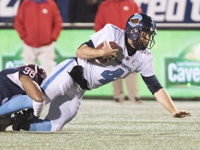 Toronto Argonauts quarterback McLeod Bethel-Thompson (4) is brought down by Montreal Alouettes' Ryan Brown during the first half in Montreal on Friday, Oct. 18, 2019. (THE CANADIAN PRESS)