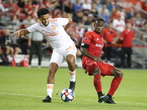 Atlanta United FC midfielder Dion Pereira battles for the ball with Toronto FC's Richie Laryea earlier this season. (USA TODAY SPORTS)
