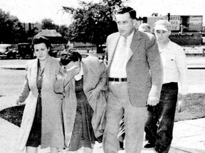 Elizabeth Popovich, centre, is led into court. She and her husband were hanged for a 1946 Thorold murder.
