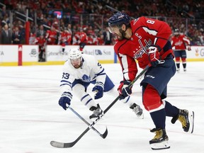 Washington Capitals left wing Alex Ovechkin (8) skates with the puck as Toronto Maple Leafs center Frederik Gauthier (33) defends during the third period at Capital One Arena. Mandatory Credit: Amber Searls-USA TODAY