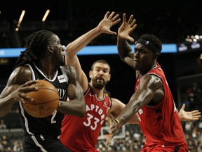 Raptors center Marc Gasol (middle) and forward Pascal Siakam (right) defend against Nets forward Taurean Prince at Barclays Center on Friday.  Nicole Sweet/USA TODAY Sports