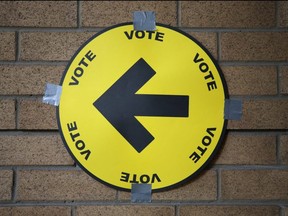 A sign directs voters to a polling station  in Toronto,