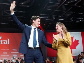 Liberal Leader and Canadian Prime Minister Justin Trudeau and his wife Sophie Gregoire Trudeau wave to supporters after the federal election at the Palais des Congres in Montreal October 22, 2019. REUTERS/Stephane Mahe