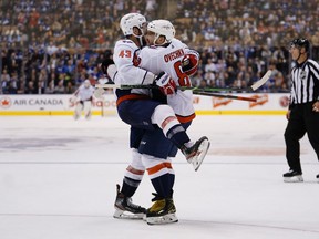 Washington Capitals forward Alex Ovechkin (8) celebrates with forward Tom Wilson (43) after scoring the game winning overtime goal against the Toronto Maple Leafs at Scotiabank Arena. John E. Sokolowski-USA TODAY