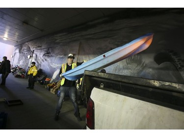 A kayak is removed by city workers after a homeless man agrees he doesn't need it anymore, on Lower Simcoe Street in Toronto on Friday, October 4, 2019. Veronica Henri/Toronto Sun/Postmedia Network