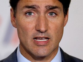 (FILES) In this file photo taken on August 26, 2019 Canada's Prime Minister Justin Trudeau addresses media representatives at a press conference in Biarritz, south-west France, on the third day of the annual G7 Summit. - Liberal Canadian Prime Minister Justin Trudeau faces a tough general election on October 21, dogged by an ethics scandal and other controversies that have taken the shine off his golden boy image and left him vulnerable to a sharp challenge from Conservative Andrew Scheer. Also in pursuit of a bigger share of Canada's political pie are social democrat Jagmeet Singh and climate crusader Elizabeth May, who hope to deny the frontrunners a majority. (Photo by Ludovic MARIN / AFP) (Photo by LUDOVIC MARIN/AFP via Getty Images)