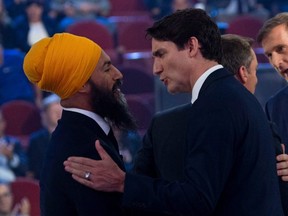 Liberal leader Justin Trudeau and NDP leader Jagmeet Singh shake hands following the Federal leaders French language debate at the Canadian Museum of History in Gatineau, Quebec on October 10, 2019.
