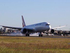 In this handout photo from Qantas shows a Qantas Boeing 787 Dreamliner plane landing at Sydney international airport after completing a non-stop test flight from New York to Sydney on October 20, 2019.   (Photo by DAVID GRAY/QANTAS/AFP via Getty Images)