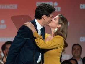 Prime Minister Justin Trudeau kisses his wife, Sophie Gregoire Trudeau, at the Palais des Congres in Montreal during Team Justin Trudeau 2019 election night event in Montreal on October 21, 2019. (Photo by SEBASTIEN ST-JEAN/AFP via Getty Images)