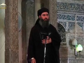A man purported to be the reclusive leader of the militant Islamic State Abu Bakr al-Baghdadi is seen at a mosque in Mosul, Iraq, in this screengrab from a video recording posted online on July 5, 2014.