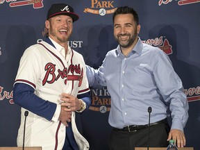 Atlanta Braves general manager Alex Anthopoulos, right, introduces Josh Donaldson during a press conference Tuesday, Nov. 27, 2018, in Atlanta. (Alyssa Pointer/Atlanta Journal-Constitution via AP)