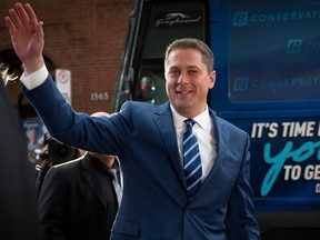 Conservative Party Leader Andrew Scheer waves as he arrives for the French debate for the 2019 federal election, at the TVA studios in Montreal, on Wednesday, Oct. 2, 2019.