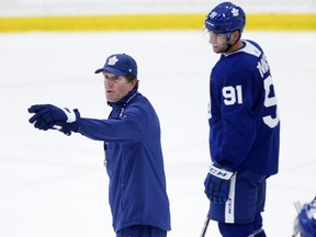 Leafs coach Mike Babcock and centre John Tavares at practice on Tuesday. STAN BEHAL/TORONTO SUN