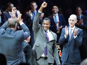 Toronto Raptors president Masai Ujiri celebrates getting his championship ring as NBA commissioner Adam Silver looks on before a game at Scotiabank Arena.