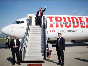Liberal leader and Canadian Prime Minister Justin Trudeau waves as he leaves his plane at the airport during an election campaign visit to Vancouver, British-Colombia, Canada October 11, 2019.