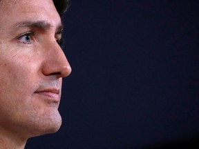 Canada's Prime Minister Justin Trudeau looks on as he speaks to the news media for the first time since winning a minority government in the federal election, at the National Press Theatre in Ottawa, Ontario, Canada October 23, 2019.
