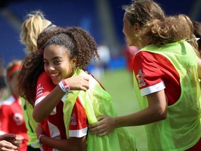Canada's Felicia Roy, middle, celebrates with teammates Canada's 1-0 victory against Germany at the Danone Nations Cup at the RCDE Stadium in Barcelona, Spain on Oct 12, 2019.