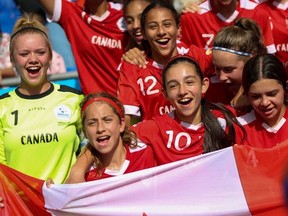 Goalkeeper Anna Swyers (No. 1), Danika Birch (No. 9), Kayla Di Tiero (10), Torrie Grant-Clavijo (4) and Christina Salama celebrate Canada's 1-0  victory against Germany with teammates at the Danone Nations Cup at the RCDE Stadium in Barcelona, Spain on Oct 12, 2019.