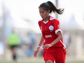 Olivia Chen of Canada chases the ball against the United States at the Danone Nations Cup at the Salou Soccer Sports Complex in Salou, Spain on Friday, Oct. 11, 2019.