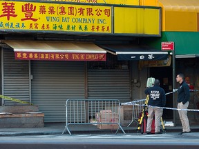 Police investigate at the scene of the killing of homeless men in Manhattan, October 5, 2019. (REUTERS/Lloyd Mitchell)