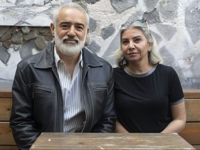 Husam Alsoufi (left) and Shahnaz Alsoufi are pictured on the patio of their restaurant Soufis in Toronto on Thursday October 10, 2019.   THE CANADIAN PRESS/Chris Young