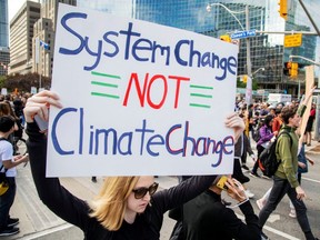 People take part in a climate change strike in Toronto, on Sept. 27, 2019.