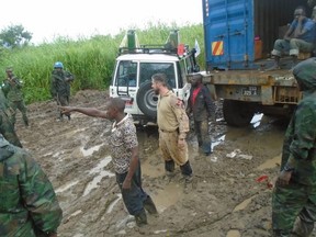 Maj. David Smith, 35 (tan uniform), is among a group of Canadian peacekeepers stationed in South Sudan this Thanksgiving who have been overcoming muddy roads to bring food and aid to locals. (supplied photo)