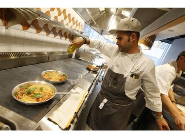 A chef makes a fresh pasta dish grand opening of 55,000 square foot Eataly Toronto grocery store - the first in Canada - is set to open in the Manulife Centre on November 13. on Wednesday October 30, 2019. Jack Boland/Toronto Sun/Postmedia Network