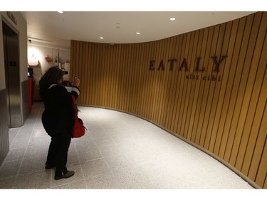 Toronto Sun National Lifestyle and Food editor Rita DeMontis takes a photo of the Eataly Toronto signage before the grand opening of 55,000 square foot Eataly Toronto grocery store - the first in Canada - is set to open in the Manulife Centre on November 13. on Wednesday October 30, 2019. Jack Boland/Toronto Sun/Postmedia Network