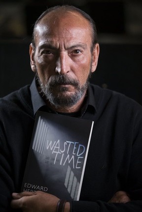 Edward Hertrich holds a copy of his memoir “Wasted Time.” (Craig Robertson/Postmedia Network)