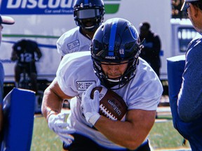 Running back A.J. Ouellette rushes the ball during an Argos practice.   TWITTER PHOTO