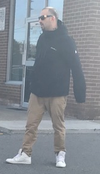 An image released by Toronto Police of a man they say was a passenger in a vehicle involved in a hit-and-run at Pharmacy and Ellesmere on Oct. 13, 2019.