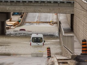 Mississauga firefighters rescued motorists from flooded Torbram Rd. (Ernest Doroszuk, Toronto Sun)