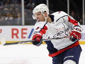 John Carlson of the Washington Capitals leads the entire NHL in points heading into Saturdays games. (Photo by Bruce Bennett/Getty Images)
