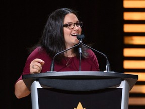 Christine Girard speaks after being inducted into the Canadian Olympic Hall of Fame during a ceremony at Glenn Gould Studio in Toronto on Oct. 23, 2019. (THE CANADIAN PRESS/HO, COC, Moe Doiron, Team Canada)