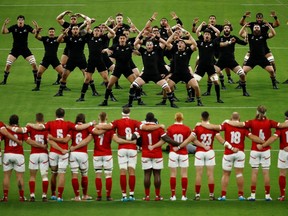New Zealand players perform the Haka dance in front of Canada players before a Rugby World Cup match on Oct. 2, 2019, in Oita, Japan. (EDGAR SU/Reuters)