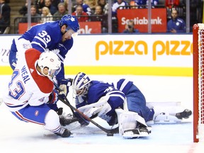 Maple Leafs goaltender Michael Hutchinson sticks his pad out to make a save on Jordan Weal of the Montreal Canadiens at Scotiabank Arena on Saturday night.  (Vaughn Ridley/Getty Images)