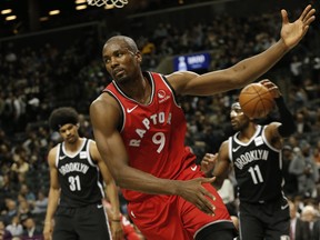 Raps’ Serge Ibaka reacts after scoring against the Nets during pre-season action at Barclays Center last night. (USA Today)