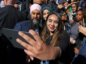 Canada's New Democratic Party Leader Jagmeet Singh meets with young adults outside Ryerson University during an election campaign stop in Toronto, on Tuesday, Oct. 8, 2019.