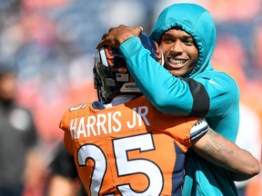 Jalen Ramsey, right, of the Jacksonville Jaguars greets Chris Harris of the Denver Broncos as players warm up before a game at Empower Field at Mile High on Sept. 29, 2019 in Denver, Colo. (Dustin Bradford/Getty Images)