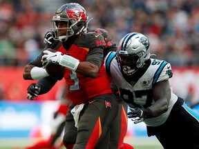 Tampa Bay Buccaneers' Jameis Winston is tackled by Carolina Panthers' Mario Addison during NFL action in London. (Action Images via Reuters/Paul Childs)